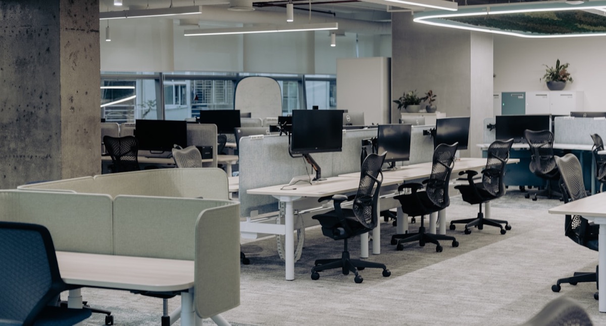 A clean, modern open-plan office with desks and chairs in Lexington KY